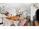 Open-concept living area seamlessly connects to the kitchen, with views of stylish furnishings at 15732 E Broncos Pl, Englewood, CO 80112