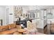Spacious living room features a stylish bar, comfortable seating, and seamless flow to kitchen at 15732 E Broncos Pl, Englewood, CO 80112