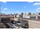 Rooftop deck featuring modern outdoor seating, a fire pit, and neighborhood views at 15732 E Broncos Pl, Englewood, CO 80112