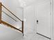 Modern staircase with sleek wooden railings and bright natural light from the windows at 15732 E Broncos Pl, Englewood, CO 80112