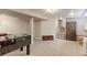 Finished basement space featuring carpet floors, foosball table, and access to the staircase at 10538 Quivas St, Northglenn, CO 80234