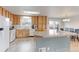 Spacious kitchen with ample cabinetry, modern appliances, and a sliding glass door at 10538 Quivas St, Northglenn, CO 80234