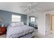 Serene bedroom with a large bed, mirrored closet, and a view to the outside at 10538 Quivas St, Northglenn, CO 80234