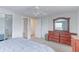 Spacious bedroom with ample closet space, a ceiling fan, and neutral decor at 10538 Quivas St, Northglenn, CO 80234