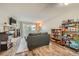 Cozy living room features a stone fireplace, sliding glass doors, and wood-look flooring at 16051 E Alaska Pl # 4, Aurora, CO 80017