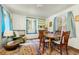 Bright dining room featuring ample natural light, classic furniture, and a tranquil view at 17422 N Canyon Rd, Littleton, CO 80127