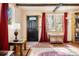 Welcoming entryway featuring hardwood floors, stylish lighting, and charming decor creating a warm and inviting atmosphere at 17422 N Canyon Rd, Littleton, CO 80127