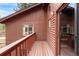 Charming cabin exterior with log siding, wood deck, and glass door for ample natural light at 17422 N Canyon Rd, Littleton, CO 80127