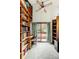 Library with floor to ceiling bookshelf and walk out to the balcony at 17422 N Canyon Rd, Littleton, CO 80127
