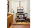Vintage stove on stone flooring creating a unique focal point and showcasing classic design at 17422 N Canyon Rd, Littleton, CO 80127