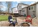 Backyard seating area with fire pit and colorful Adirondack chairs, ideal for outdoor gatherings at 331 Chelsea St, Castle Rock, CO 80104