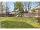 Lush green backyard featuring a well-maintained lawn and a wooden fence for privacy at 331 Chelsea St, Castle Rock, CO 80104