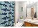 Bathroom featuring a patterned shower curtain, toilet and vanity at 331 Chelsea St, Castle Rock, CO 80104