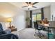Bedroom featuring a ceiling fan, a desk and a cozy chair with a throw blanket at 331 Chelsea St, Castle Rock, CO 80104