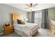 Comfortable bedroom with a ceiling fan, natural light, and a wood headboard at 331 Chelsea St, Castle Rock, CO 80104