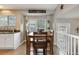 Cozy dining area features a wooden table set and natural light from the windows at 331 Chelsea St, Castle Rock, CO 80104