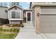 Inviting front entrance with decorative wreath and landscaping leading to a cozy home at 331 Chelsea St, Castle Rock, CO 80104
