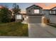 Charming home featuring a well-manicured lawn, attached garage, and beautiful exterior paint at 331 Chelsea St, Castle Rock, CO 80104