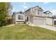 Charming two-story home with a well-manicured lawn, a two-car garage, and inviting curb appeal at 331 Chelsea St, Castle Rock, CO 80104
