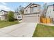 Well-maintained home with a two-car garage, beautiful lawn, and a long driveway at 331 Chelsea St, Castle Rock, CO 80104