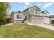 Attractive two-story home with neutral siding, brick accents, and a well-kept front yard at 331 Chelsea St, Castle Rock, CO 80104