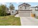 Charming two-story home with a well-manicured lawn, a two-car garage, and inviting curb appeal at 331 Chelsea St, Castle Rock, CO 80104