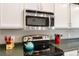 Close-up of kitchen showing stainless steel appliances and ample counter space at 331 Chelsea St, Castle Rock, CO 80104