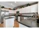 Updated kitchen equipped with stainless steel appliances and ample counter space at 331 Chelsea St, Castle Rock, CO 80104