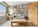 Bright living room with open shelving, natural wood accents and neutral paint at 331 Chelsea St, Castle Rock, CO 80104