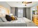 Main bedroom with ensuite bathroom, natural light, and wooden headboard at 331 Chelsea St, Castle Rock, CO 80104