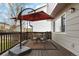 Outdoor patio with a metal table and chairs and a large patio umbrella at 331 Chelsea St, Castle Rock, CO 80104