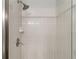 An enclosed shower with white tiling and modern fixtures at 331 Chelsea St, Castle Rock, CO 80104