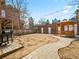 Large backyard featuring a wooden gazebo, brick fencing, and an outdoor grill area at 945 N Washington St # 201, Denver, CO 80203