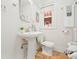 Classic bathroom with pedestal sink, tiled floor, and vintage fixtures offer old world charm at 945 N Washington St # 201, Denver, CO 80203