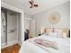 Cozy bedroom with hardwood floors, ceiling fan, closet and decorative accents create a peaceful retreat at 945 N Washington St # 201, Denver, CO 80203
