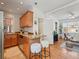 Eat-in kitchen area with tiled floors, wooden cabinets, and stainless-steel appliances at 945 N Washington St # 201, Denver, CO 80203