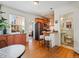 The open living space showcases hardwood floors and leads to the kitchen and bathroom at 945 N Washington St # 201, Denver, CO 80203