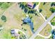 Aerial view of the property featuring a long driveway and lush green lawn at 9232 N Surrey Dr, Castle Rock, CO 80108