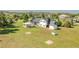 Expansive backyard featuring a cozy patio, storage shed, and well-maintained lawn, perfect for outdoor activities at 9232 N Surrey Dr, Castle Rock, CO 80108