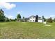 Expansive backyard with lush lawn, featuring a charming pergola-covered patio and convenient storage shed at 9232 N Surrey Dr, Castle Rock, CO 80108