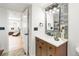 Stylish bathroom with modern vanity, unique mirror, and designer finishes at 9232 N Surrey Dr, Castle Rock, CO 80108