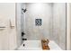 Modern bathroom features a soaking tub with stylish tile surround and black fixtures at 9232 N Surrey Dr, Castle Rock, CO 80108