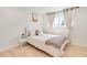 Cozy bedroom with neutral tones, natural light from the window, and minimalist decor at 9232 N Surrey Dr, Castle Rock, CO 80108