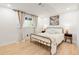 Cozy bedroom with warm lighting, neutral tones, and ample natural light at 9232 N Surrey Dr, Castle Rock, CO 80108
