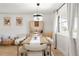 Cozy dining area featuring modern lighting, stylish furniture, and hardwood floors at 9232 N Surrey Dr, Castle Rock, CO 80108
