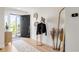 Bright entryway featuring wood floors, modern decor, and an open door to the outdoor area at 9232 N Surrey Dr, Castle Rock, CO 80108