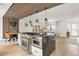 Spacious open-concept kitchen with a large island, stainless steel appliances, and modern design at 9232 N Surrey Dr, Castle Rock, CO 80108