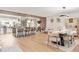 Open-concept living space with wood floors, a kitchen island, and a dining area at 9232 N Surrey Dr, Castle Rock, CO 80108