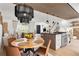 Open floor plan showcasing the kitchen, dining area, and living room with stylish lighting at 9232 N Surrey Dr, Castle Rock, CO 80108