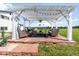 Charming outdoor seating area with pergola, comfortable furniture, and serene views at 9232 N Surrey Dr, Castle Rock, CO 80108